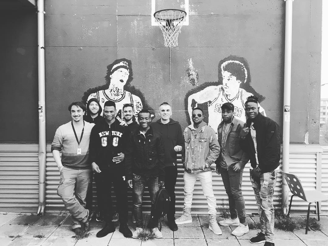 A group of people posing for a photo

Description automatically generated