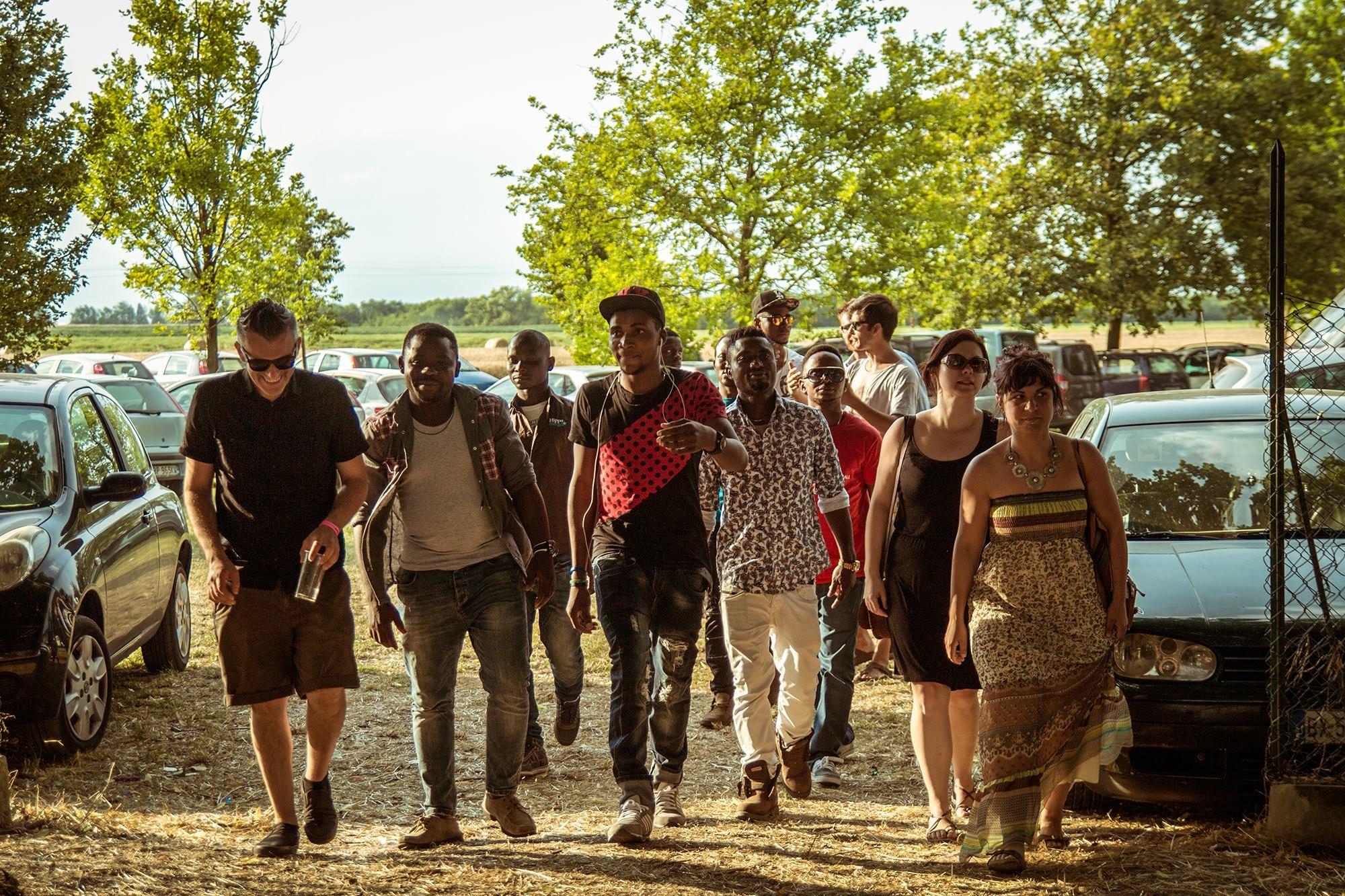 A group of people walking on a street

Description automatically generated with medium confidence