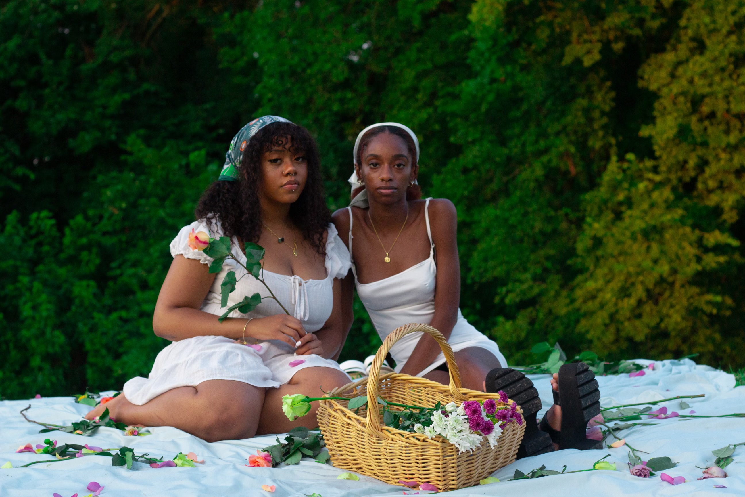 A picnic on a sunny afternoon, with flowers sprawled about. Meant to illustrate calm and comfort, feelings often overlooked within the black experience.